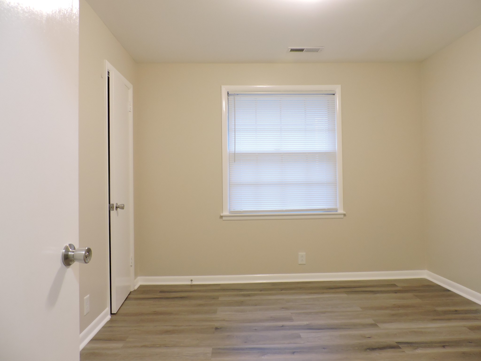 355 9th Avenue North, Unit B Franklin, TN 37064 - Photo 8 of 21 a view of an empty room with wooden floor