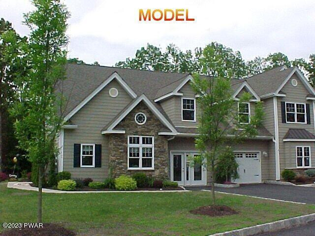 210 Braeburn Path Matamoras, PA 18336 - Photo 1 of 14 a front view of a house with a yard