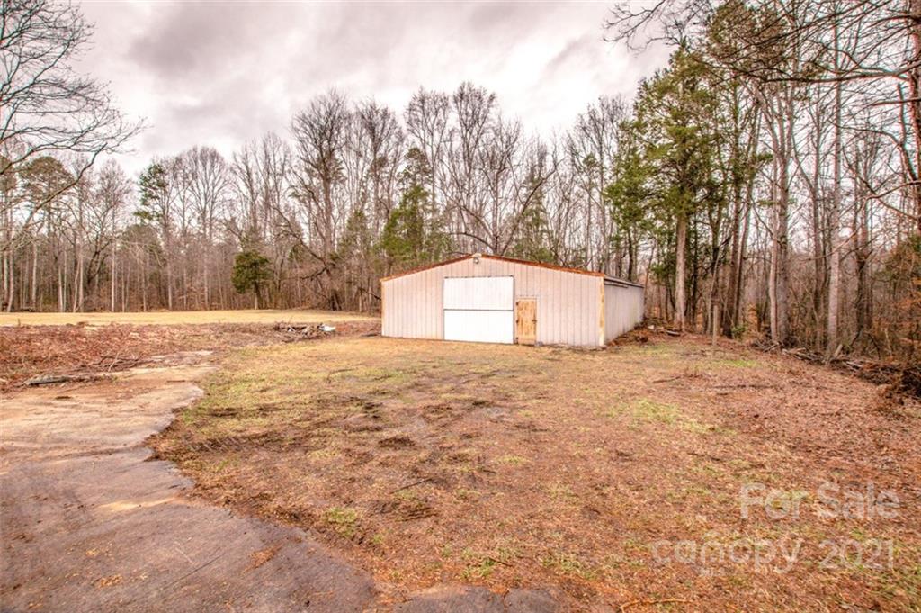 255 Rock Hump Road Salisbury, NC 28147 - Photo 22 of 39 a view of white house with a yard and covered with snow