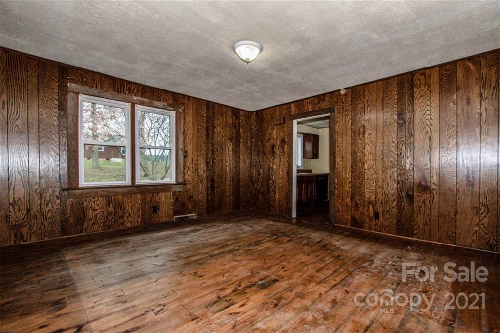 255 Rock Hump Road Salisbury, NC 28147 - Photo 27 of 39 an empty room with windows