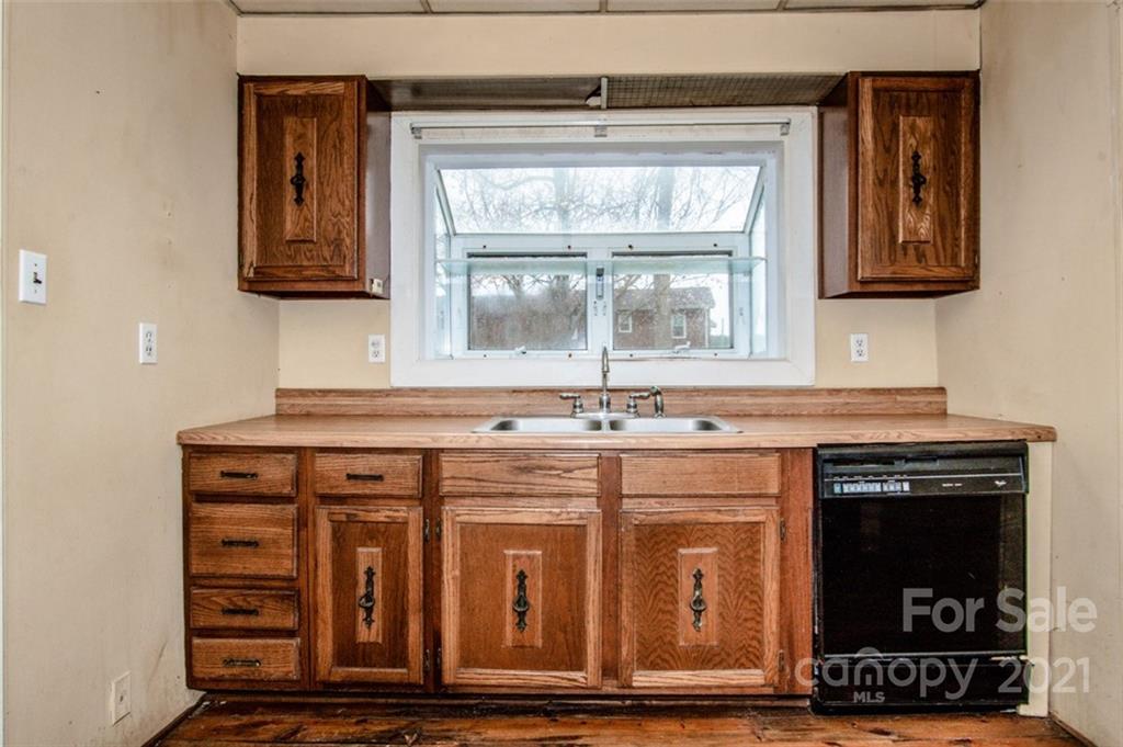 255 Rock Hump Road Salisbury, NC 28147 - Photo 28 of 39 a kitchen with stainless steel appliances a stove and a microwave oven