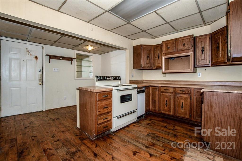 255 Rock Hump Road Salisbury, NC 28147 - Photo 30 of 39 a kitchen with stainless steel appliances granite countertop a stove a sink and a microwave