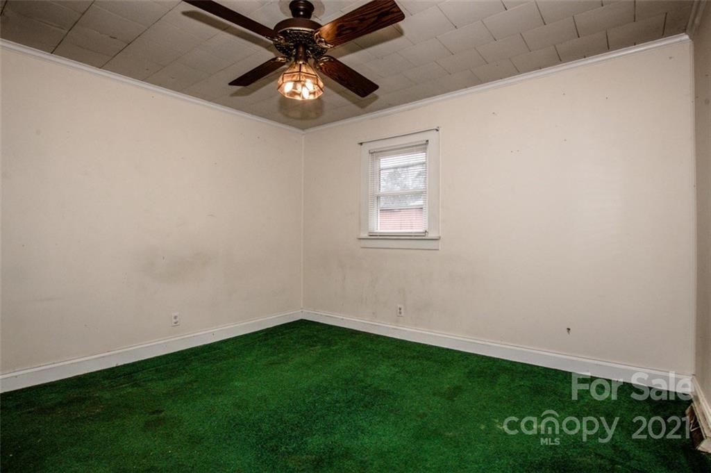 255 Rock Hump Road Salisbury, NC 28147 - Photo 32 of 39 an empty room with a window and a fan