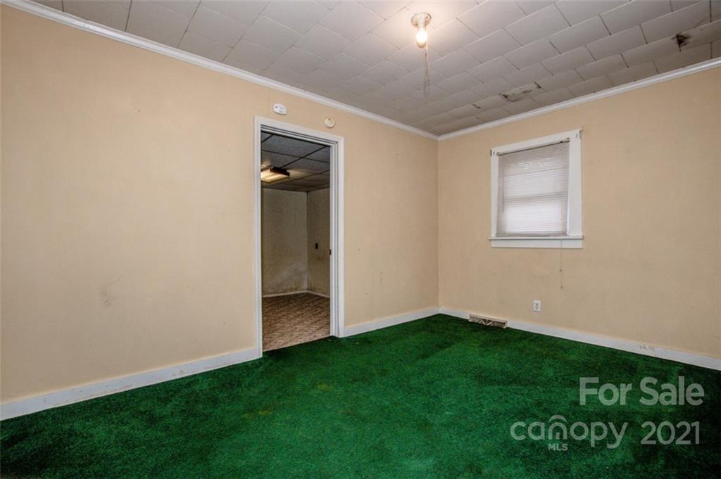 255 Rock Hump Road Salisbury, NC 28147 - Photo 35 of 39 a view of an empty room with window and wooden floor