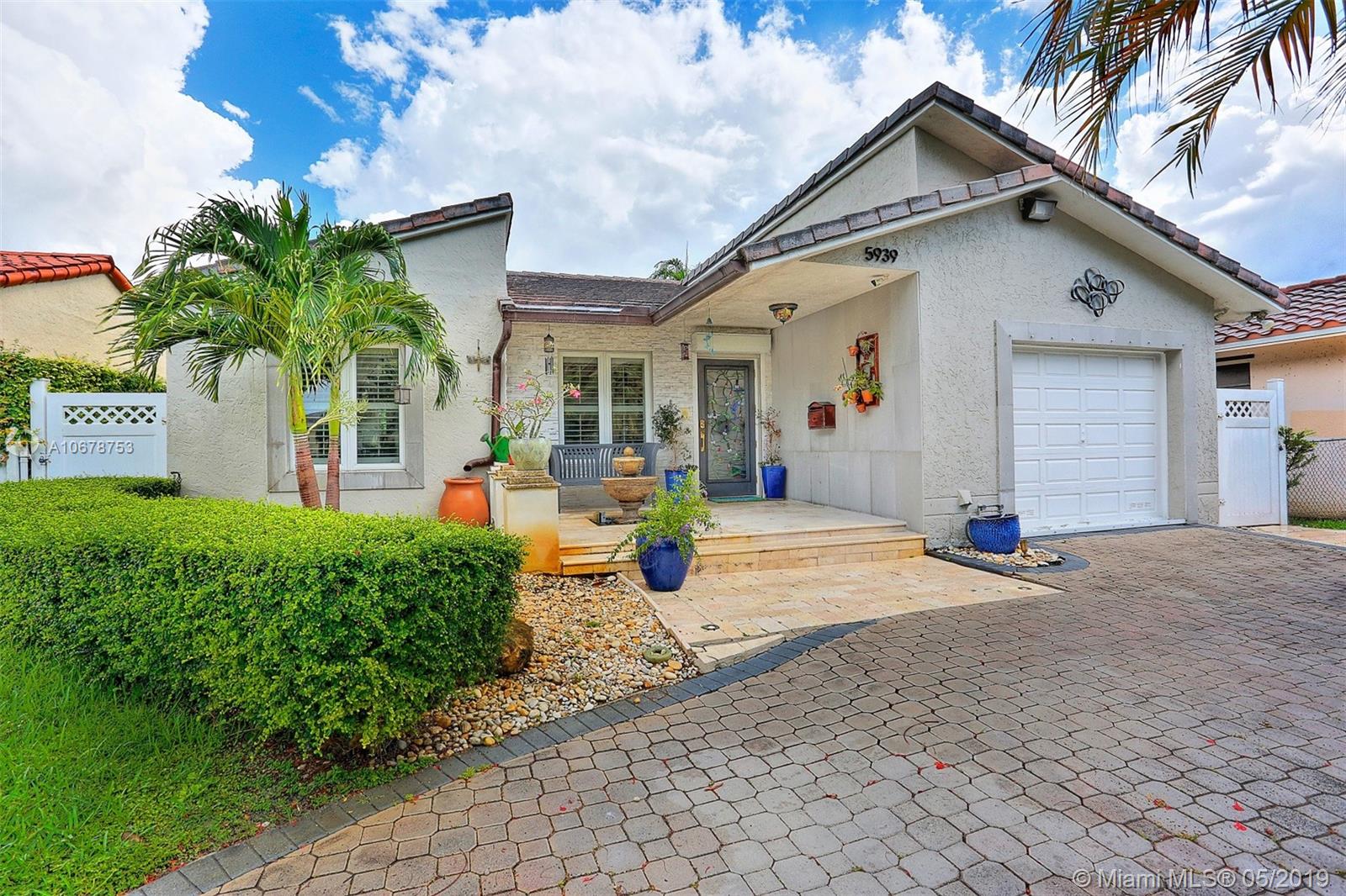 5939 Southwest 34th Street Miami, FL 33155 - Photo 1 of 30 Impeccably-designed 3-bedroom home in Schenley Park with an updated kitchen, bright open spaces, vaulted ceilings, large impact-resistant windows, bountiful storage space and enjoyable exterior spaces.