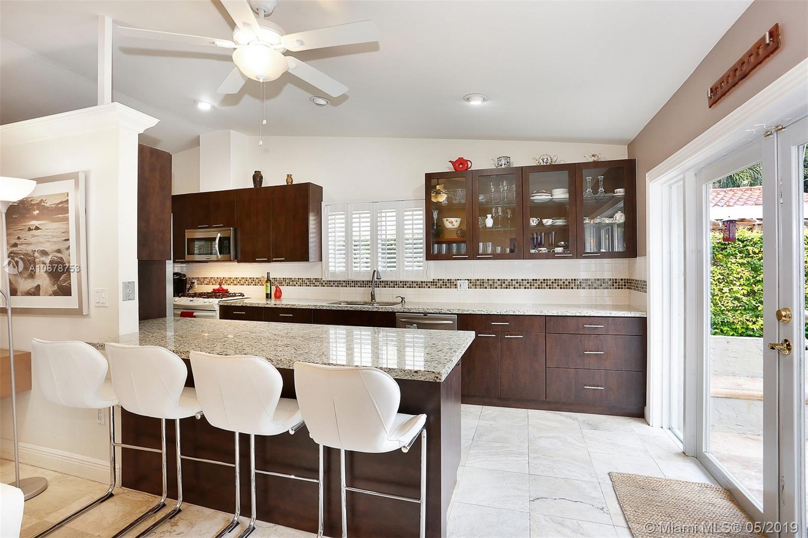 5939 Southwest 34th Street Miami, FL 33155 - Photo 10 of 30 Do you love to cook and entertain? This updated eat-in kitchen with a gas range allows you to do both with plenty of space to prep and execute your favorite dishes while entertaining guests in the family room, living room, dining room AND courtyard.