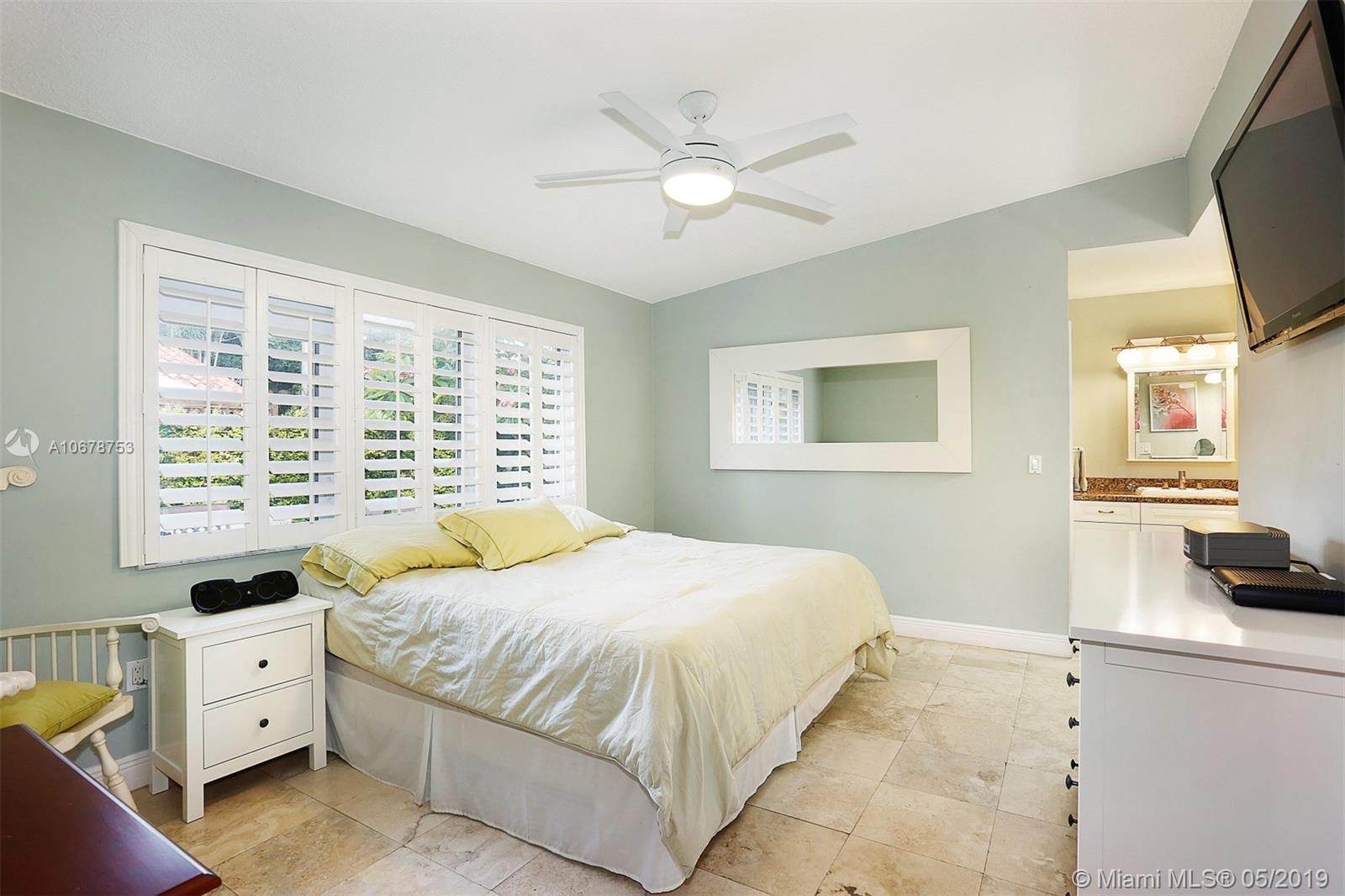 5939 Southwest 34th Street Miami, FL 33155 - Photo 14 of 30 Master suite complete with walk-in closet, ensuite bath and makeup vanity.