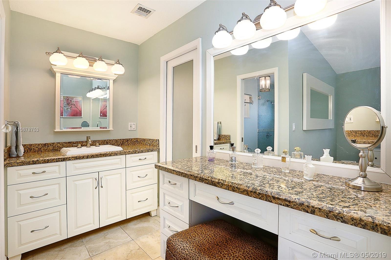 5939 Southwest 34th Street Miami, FL 33155 - Photo 15 of 30 Master suite complete with walk-in closet, ensuite bath and makeup vanity.