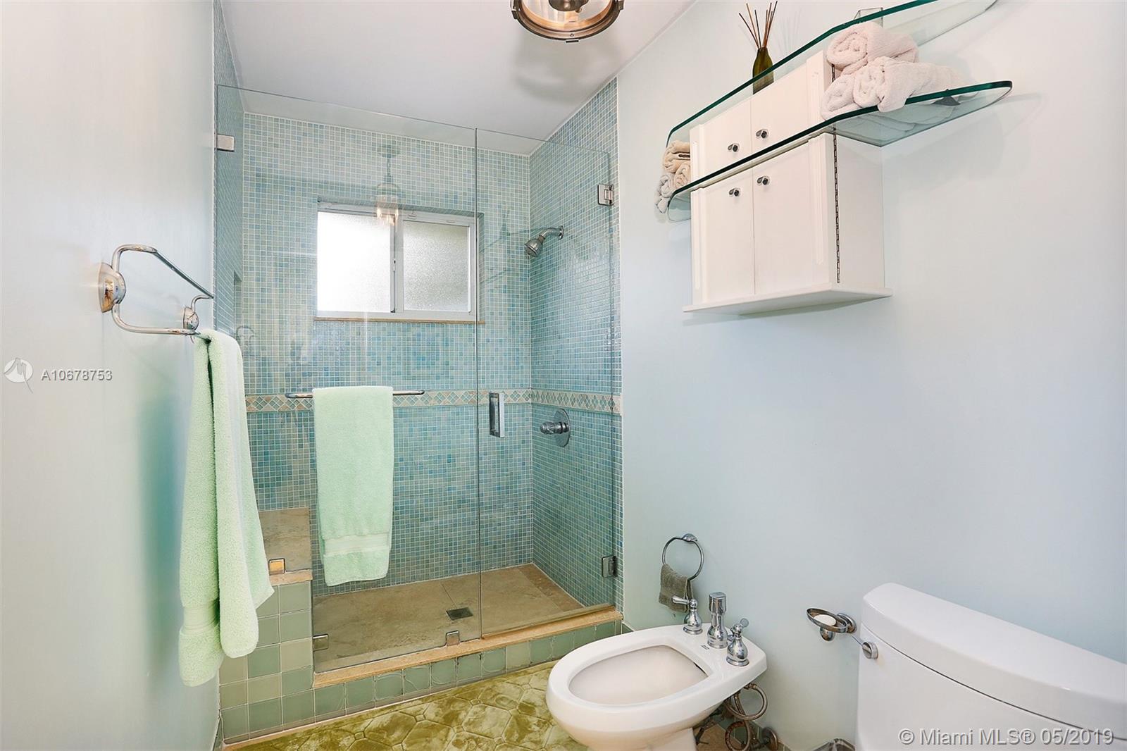 5939 Southwest 34th Street Miami, FL 33155 - Photo 16 of 30 Master suite complete with walk-in closet, ensuite bath and makeup vanity.