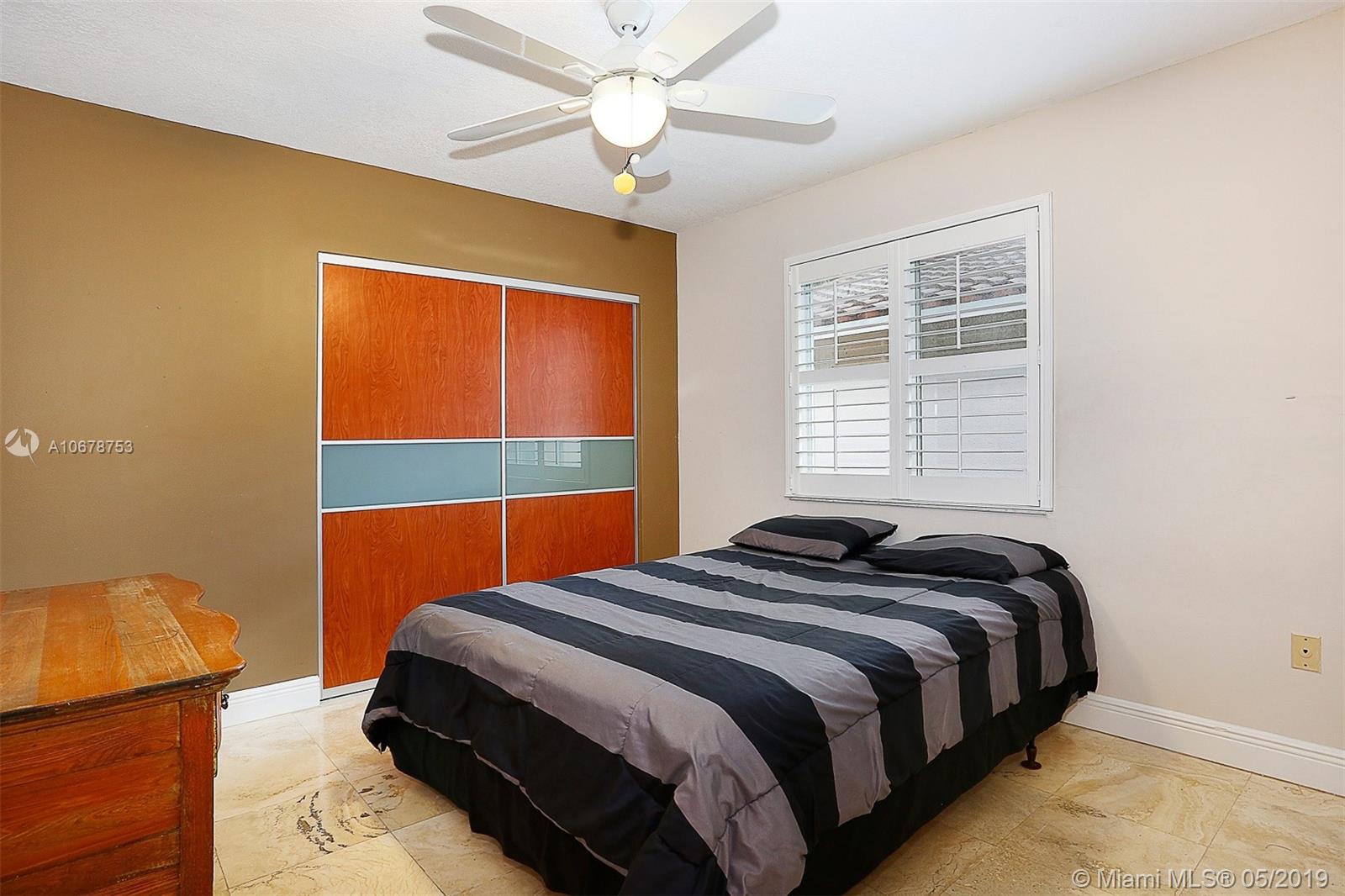 5939 Southwest 34th Street Miami, FL 33155 - Photo 19 of 30 3rd Bedroom with custom step-in closet.