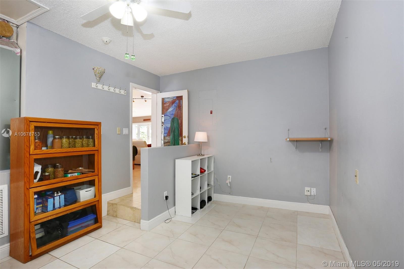 5939 Southwest 34th Street Miami, FL 33155 - Photo 21 of 30 Converted garage with versatile uses: home office, play room, storage, man cave...you decide how you use this space.