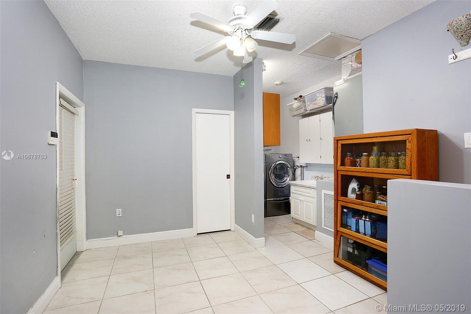 5939 Southwest 34th Street Miami, FL 33155 - Photo 22 of 30 Converted garage with versatile uses: home office, play room, storage, man cave...you decide how you use this space.