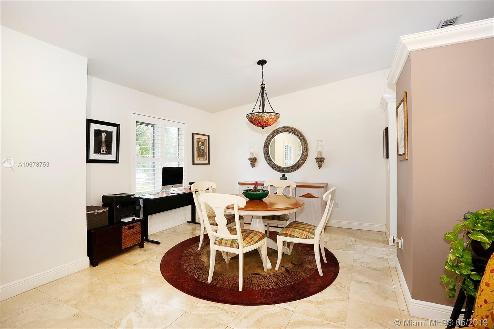 5939 Southwest 34th Street Miami, FL 33155 - Photo 8 of 30 Dining area conveniently located with direct access to the updated and open galley kitchen.