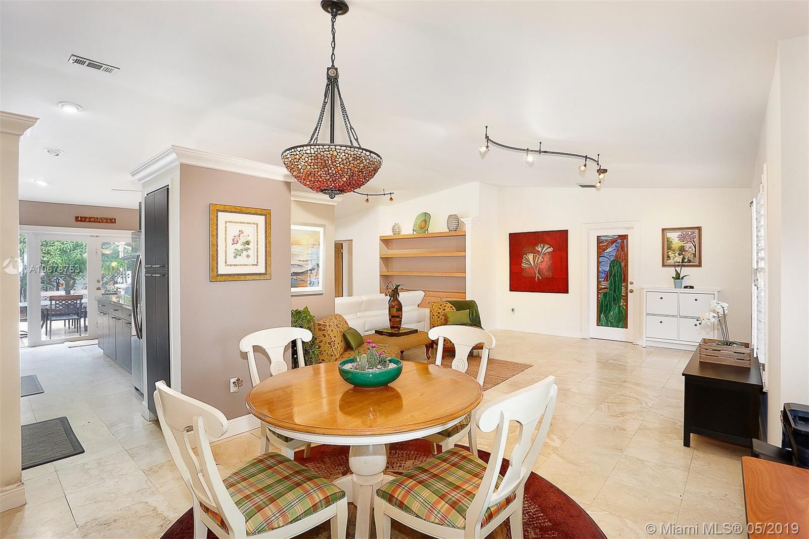 5939 Southwest 34th Street Miami, FL 33155 - Photo 9 of 30 Dining area conveniently located with direct access to the updated and open galley kitchen.