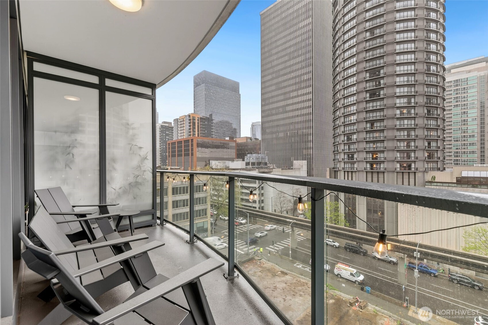 1920 4th Avenue, Unit 509 Seattle, WA 98101 - Photo 18 of 33 a view of a balcony with chairs