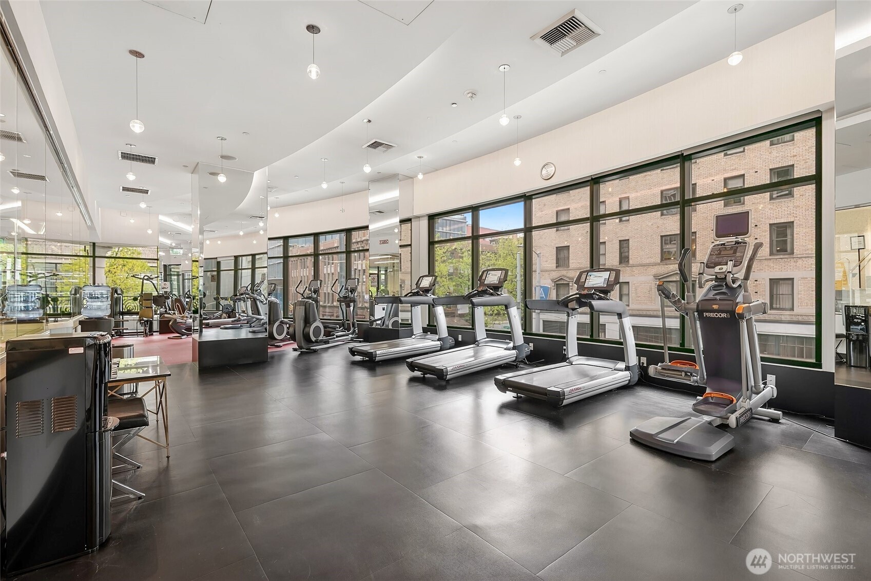 1920 4th Avenue, Unit 509 Seattle, WA 98101 - Photo 30 of 33 a gym room with lots of gym equipment