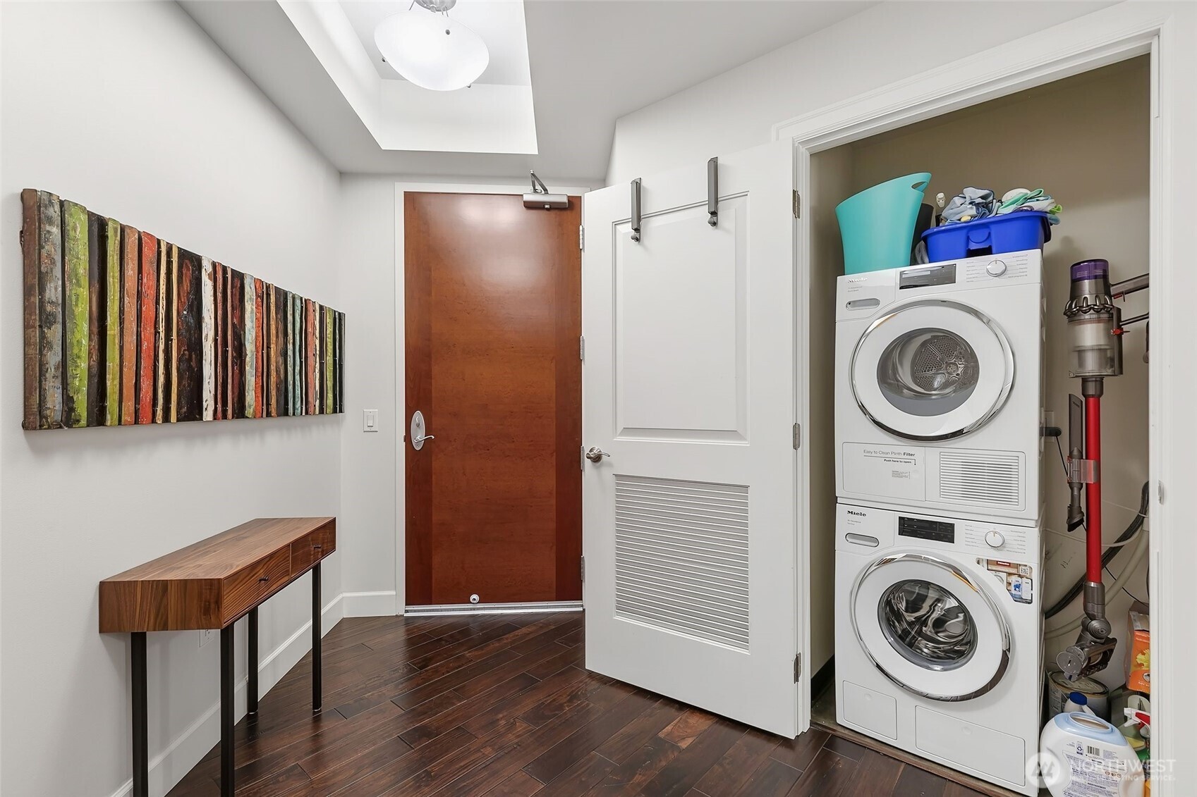 1920 4th Avenue, Unit 509 Seattle, WA 98101 - Photo 3 of 33 a view of a storage and utility room with washer and dryer