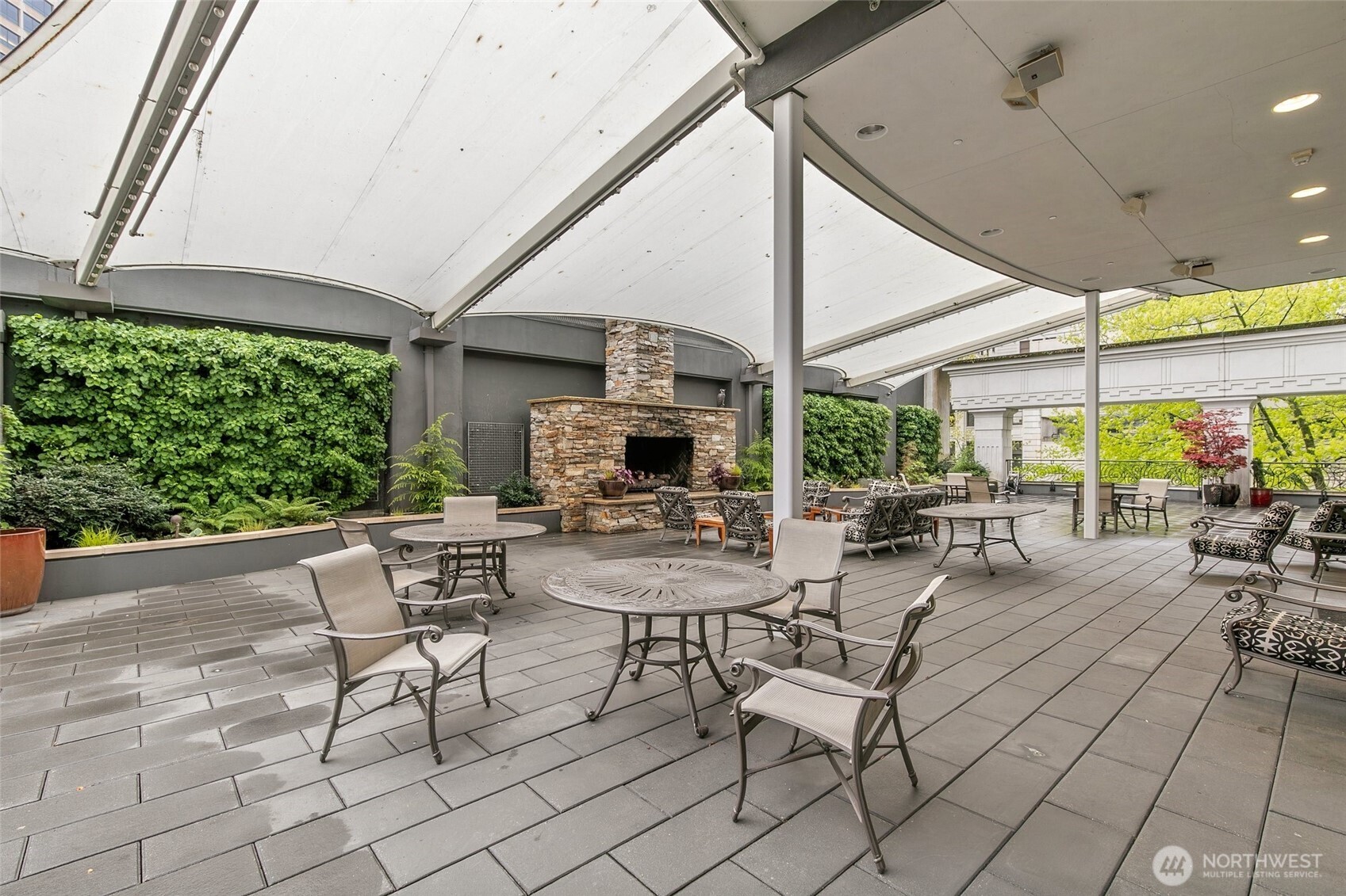 1920 4th Avenue, Unit 509 Seattle, WA 98101 - Photo 32 of 33 a view of a patio with chairs and tables