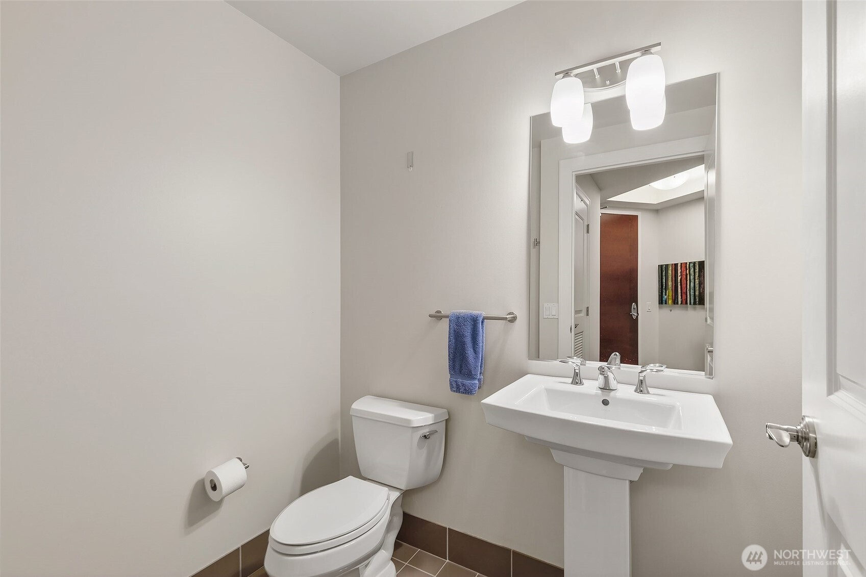 1920 4th Avenue, Unit 509 Seattle, WA 98101 - Photo 4 of 33 a bathroom with a sink a toilet and mirror