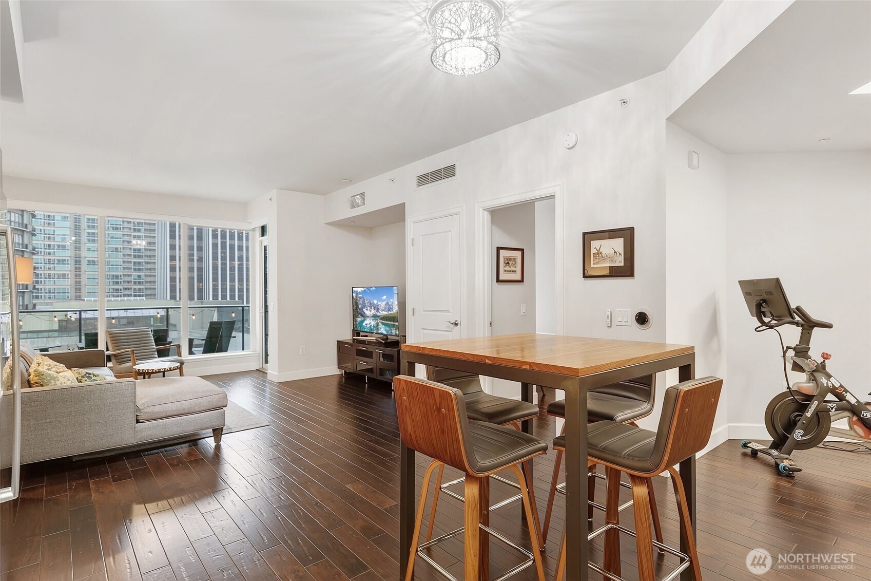 1920 4th Avenue, Unit 509 Seattle, WA 98101 - Photo 8 of 33 a dining room with furniture and wooden floor