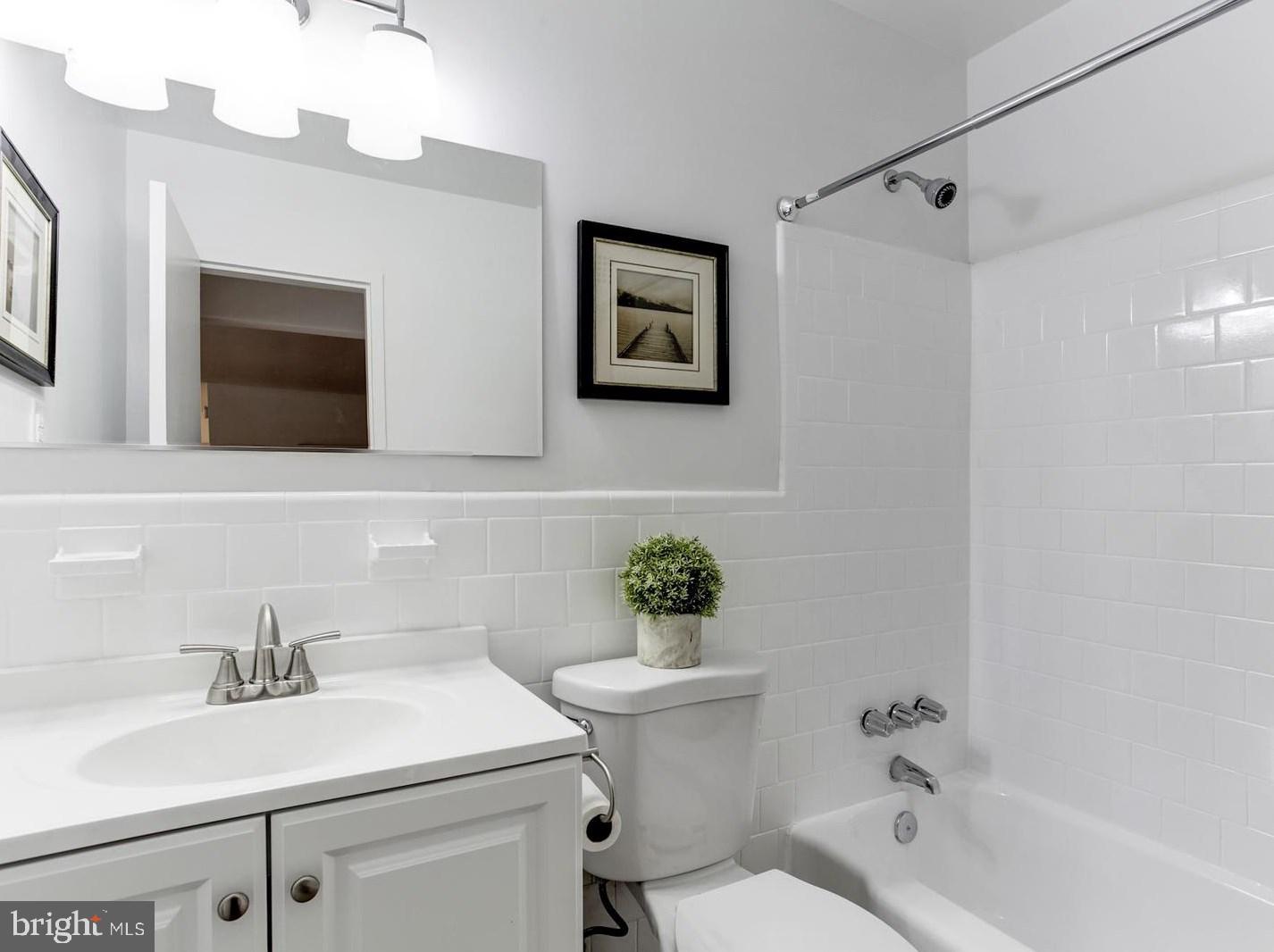 2400 41st Street Northwest, Unit 203 Washington, DC 20007 - Photo 20 of 24 a bathroom with a sink a toilet and shower