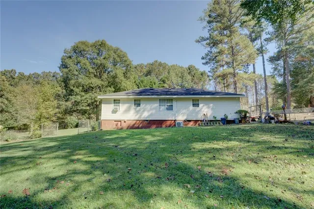 a view of a house with a big yard
