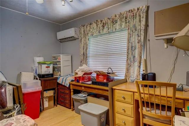 a bedroom with furniture and a window