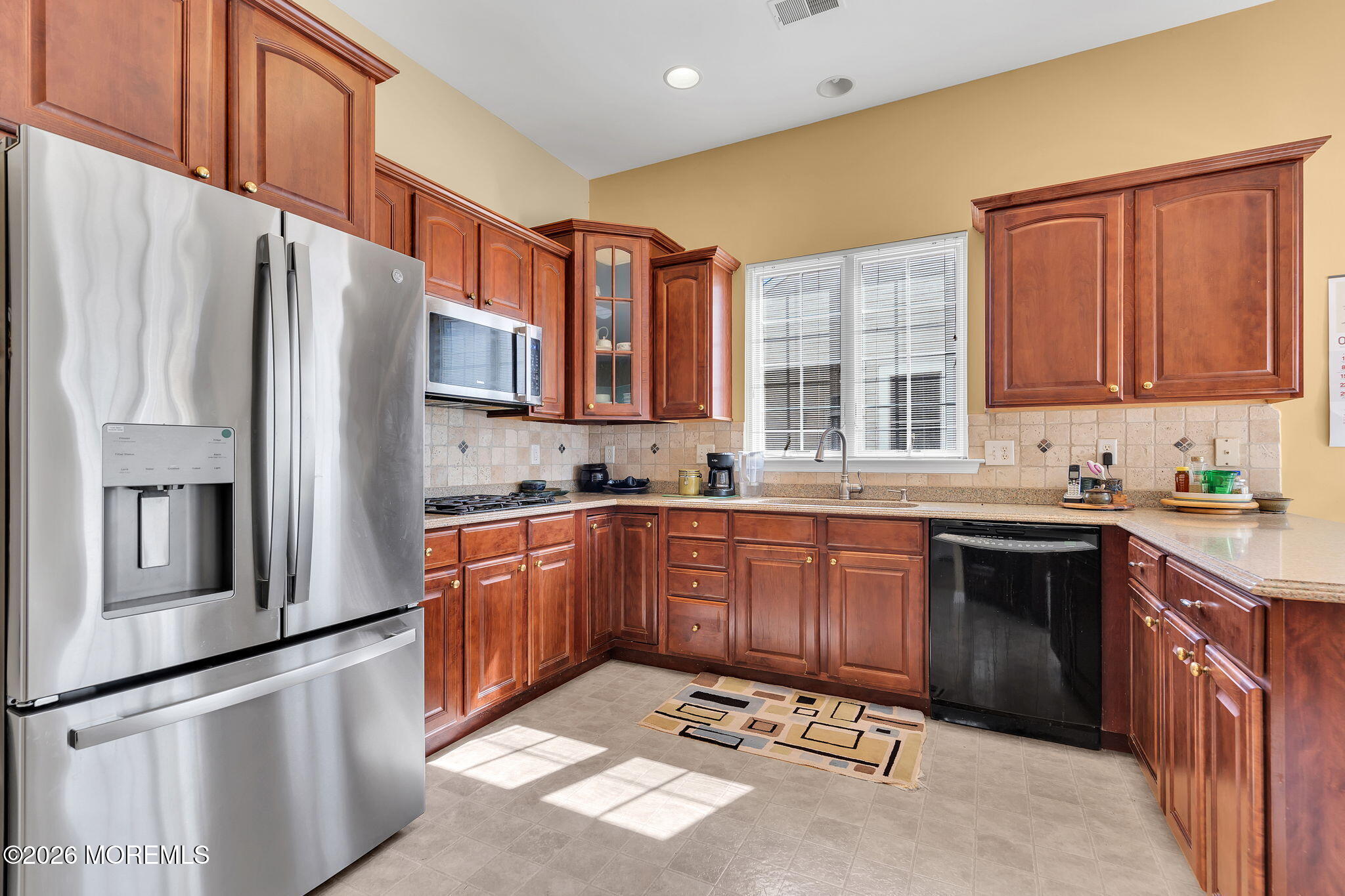 35 Spring Lake Boulevard Waretown, NJ 08758 - Photo 13 of 51 a kitchen with stainless steel appliances granite countertop a refrigerator sink and wooden cabinets