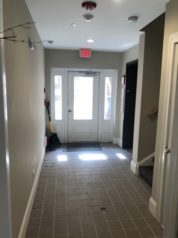 515 Summit Avenue, Unit D Park Ridge, IL 60068 - Photo 17 of 18 wooden floor in an empty room with a window