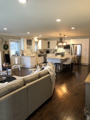 515 Summit Avenue, Unit D Park Ridge, IL 60068 - Photo 5 of 18 a living room with furniture a flat screen tv and kitchen view