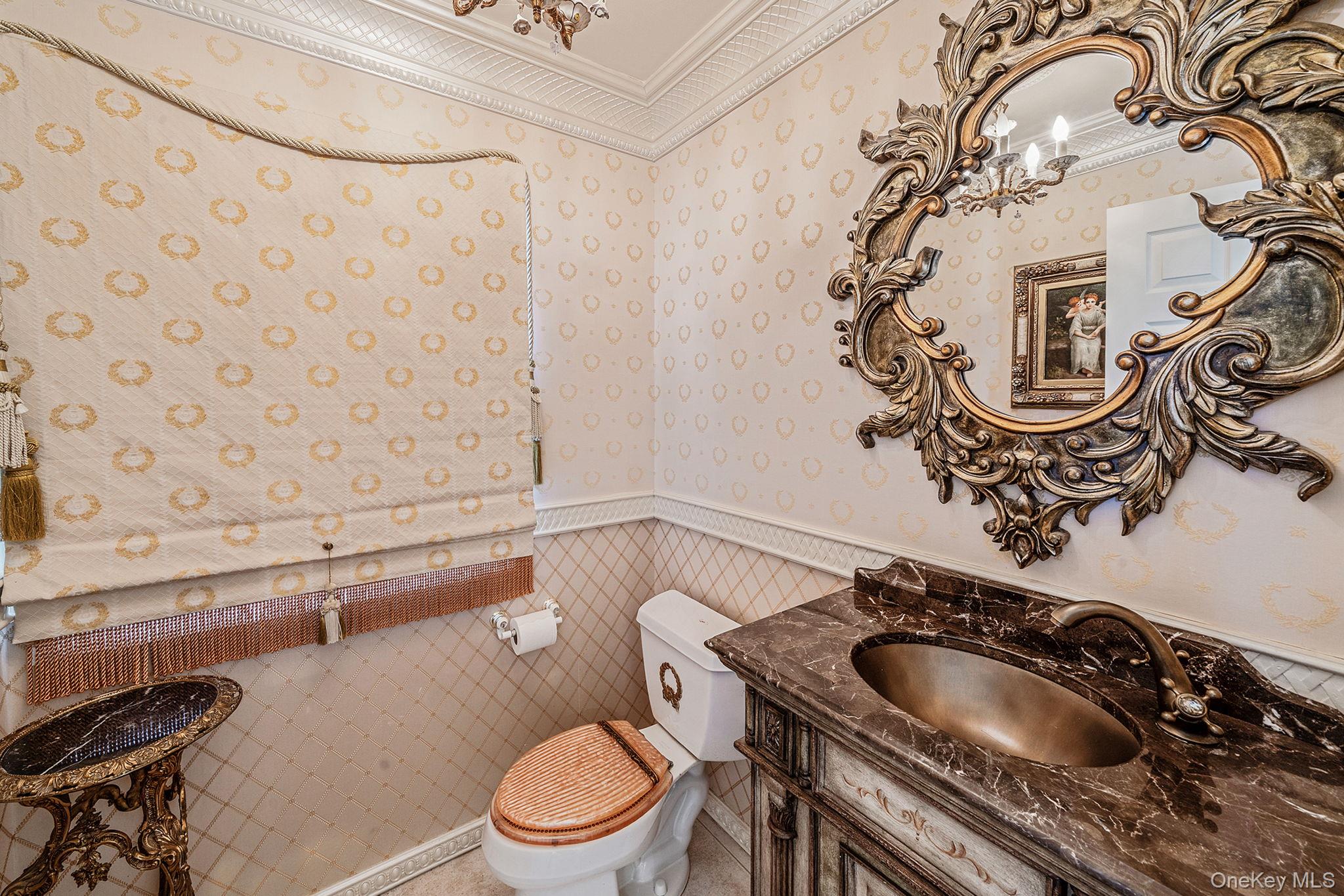 148 Country Club Drive Commack, NY 11725 - Photo 19 of 50 a bathroom with a sink a toilet and mirror