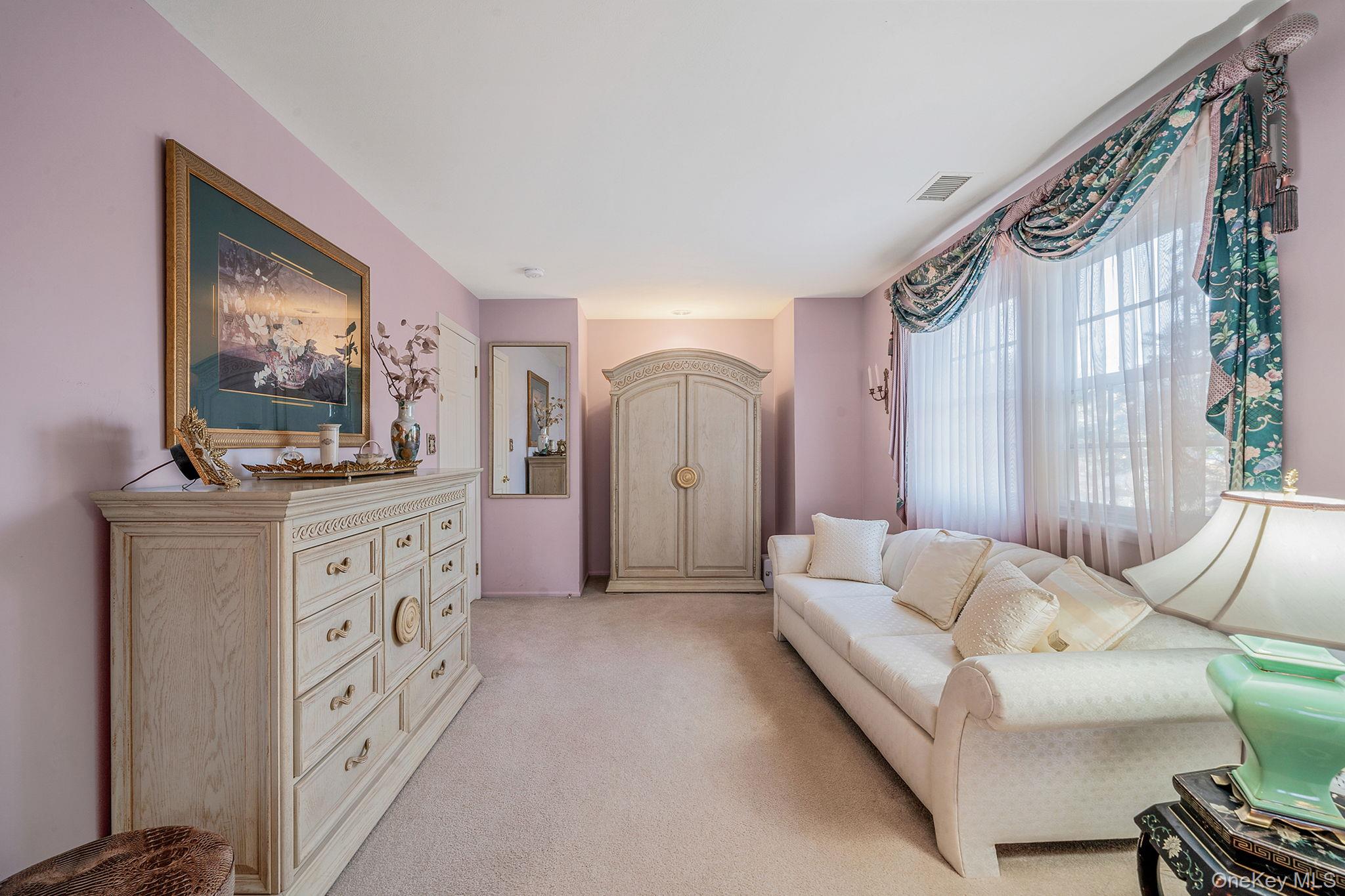148 Country Club Drive Commack, NY 11725 - Photo 25 of 50 a living room with furniture and a flat screen tv