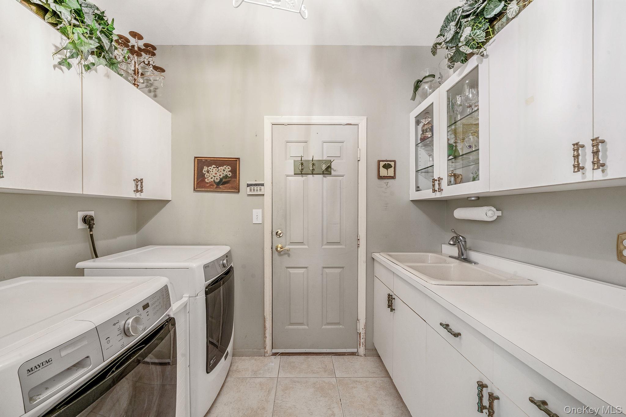 148 Country Club Drive Commack, NY 11725 - Photo 37 of 50 a view of a bathroom with a sink and mirror