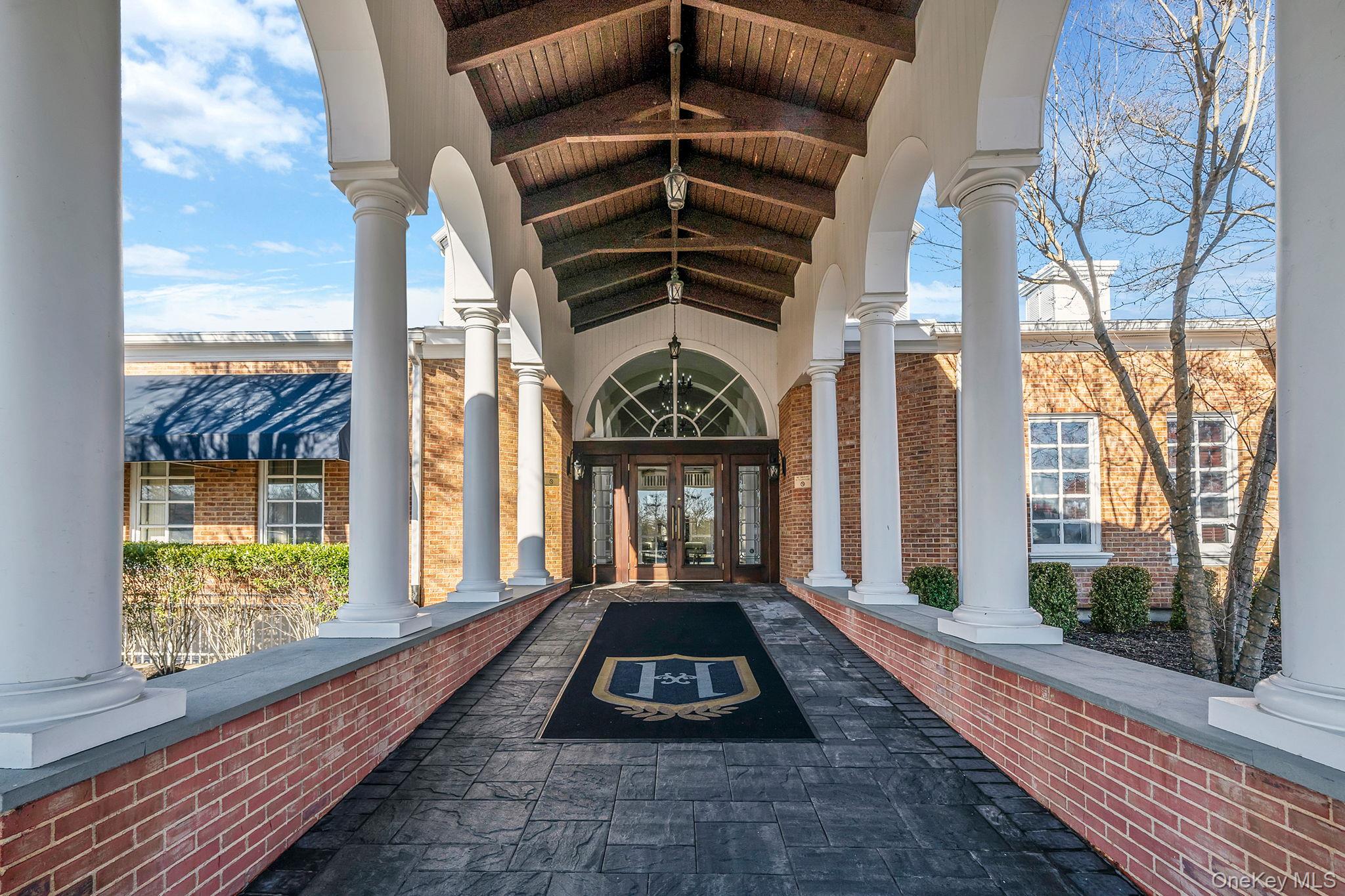 148 Country Club Drive Commack, NY 11725 - Photo 42 of 50 a front view of a house with a yard