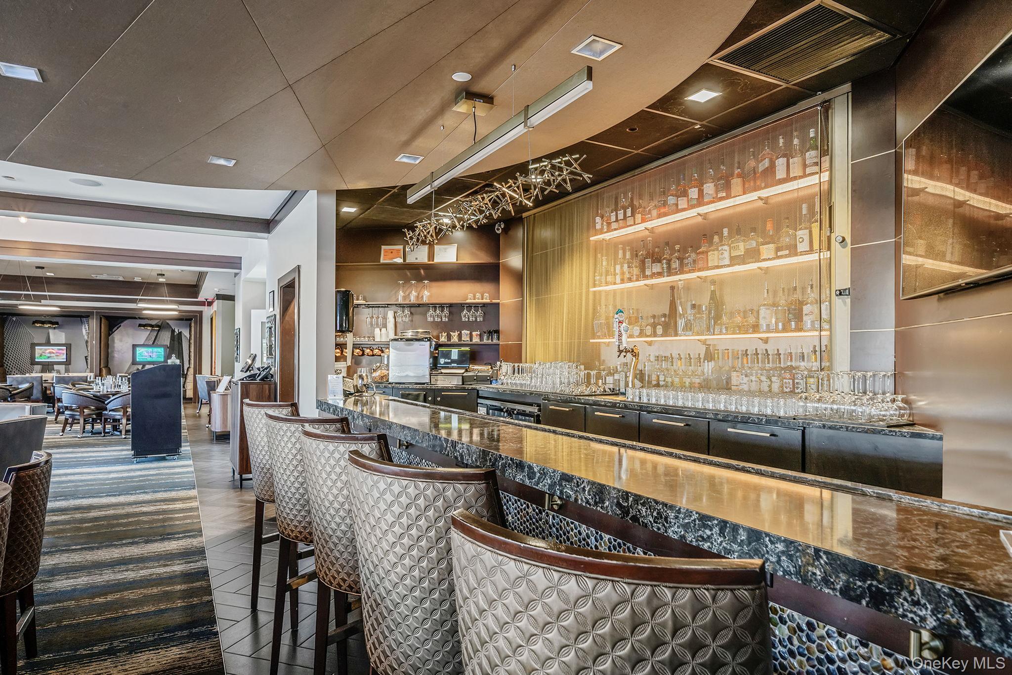 148 Country Club Drive Commack, NY 11725 - Photo 45 of 50 a kitchen with granite countertop lots of counter top space and living room