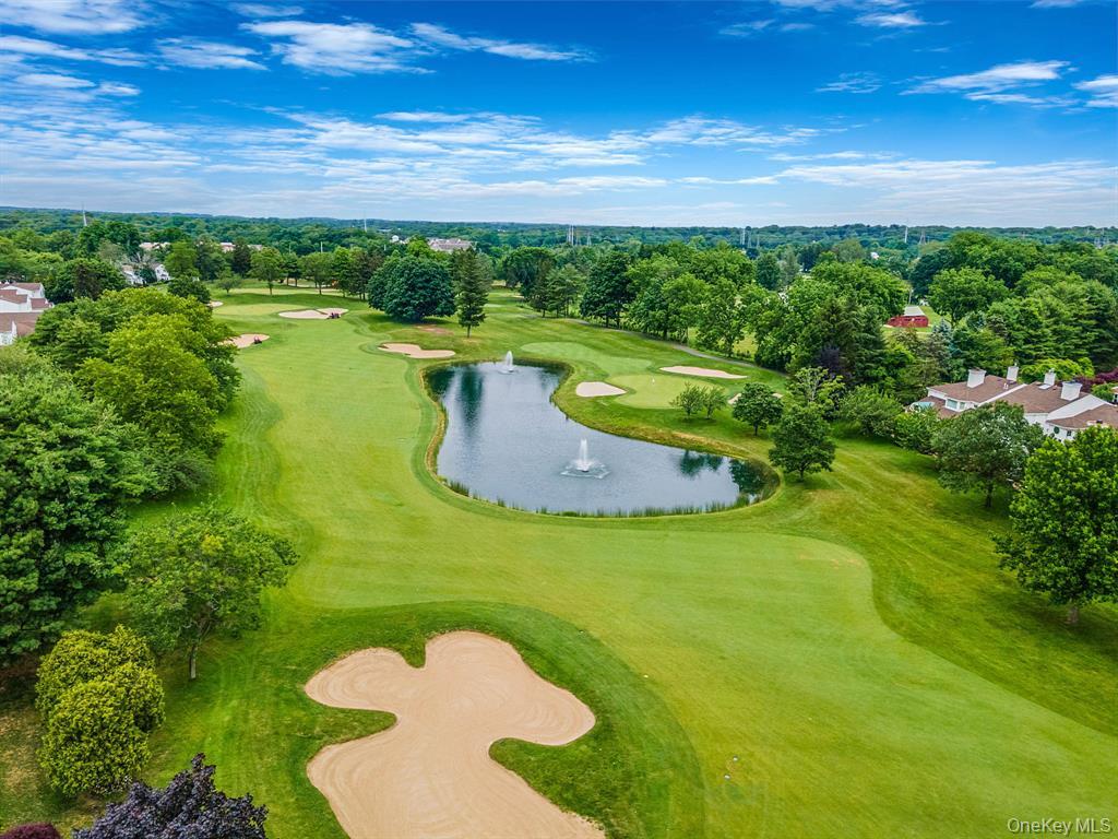 148 Country Club Drive Commack, NY 11725 - Photo 47 of 50 a view of a lake with a yard