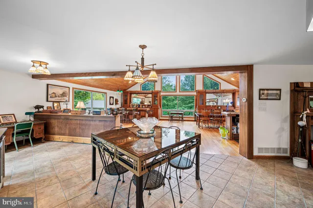 a view of a dining room with furniture and a table