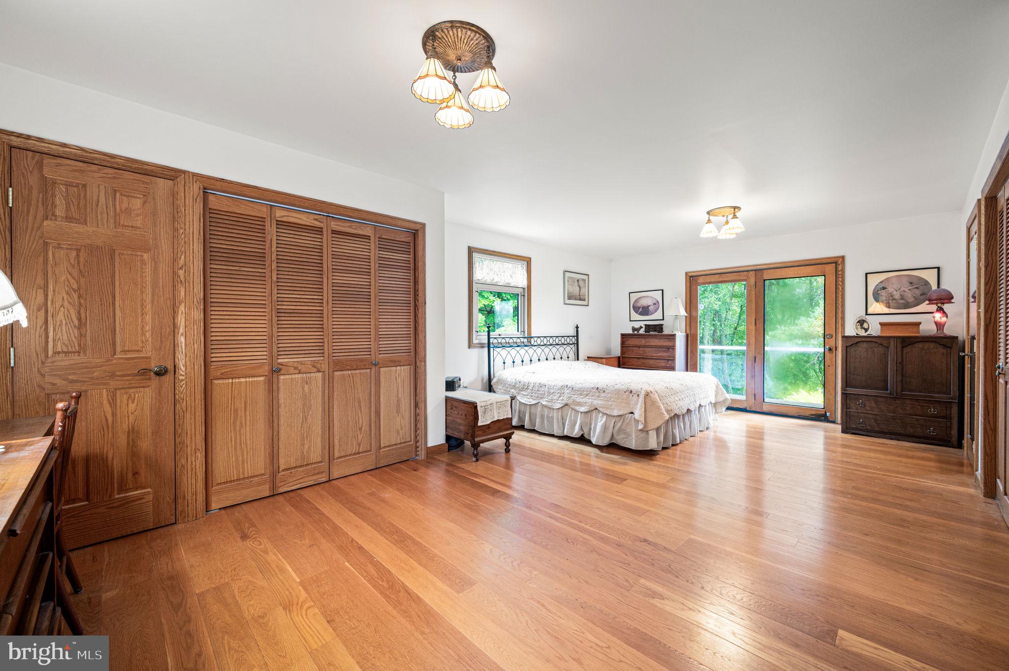 38 Lutz Road Boyertown, PA 19512 - Photo 16 of 49 a bedroom with a large bed and a large window