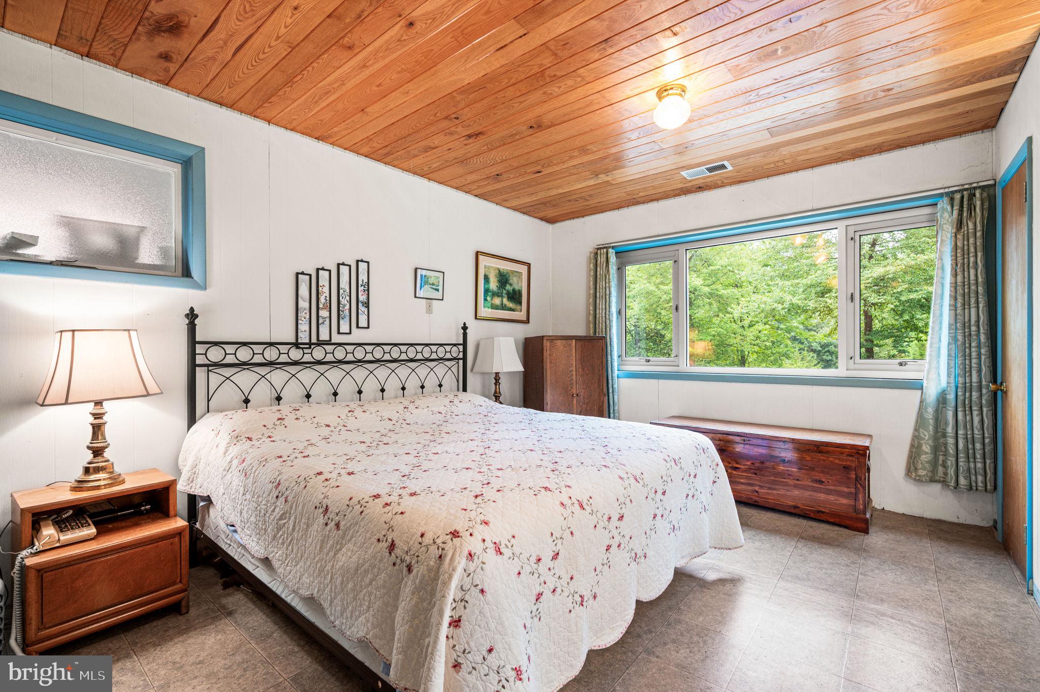 38 Lutz Road Boyertown, PA 19512 - Photo 27 of 49 a bedroom with a large bed and a large window