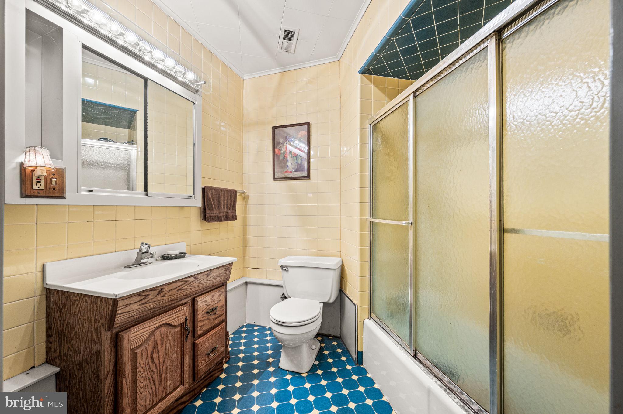 38 Lutz Road Boyertown, PA 19512 - Photo 28 of 49 a bathroom with a sink a toilet a shower and a mirror