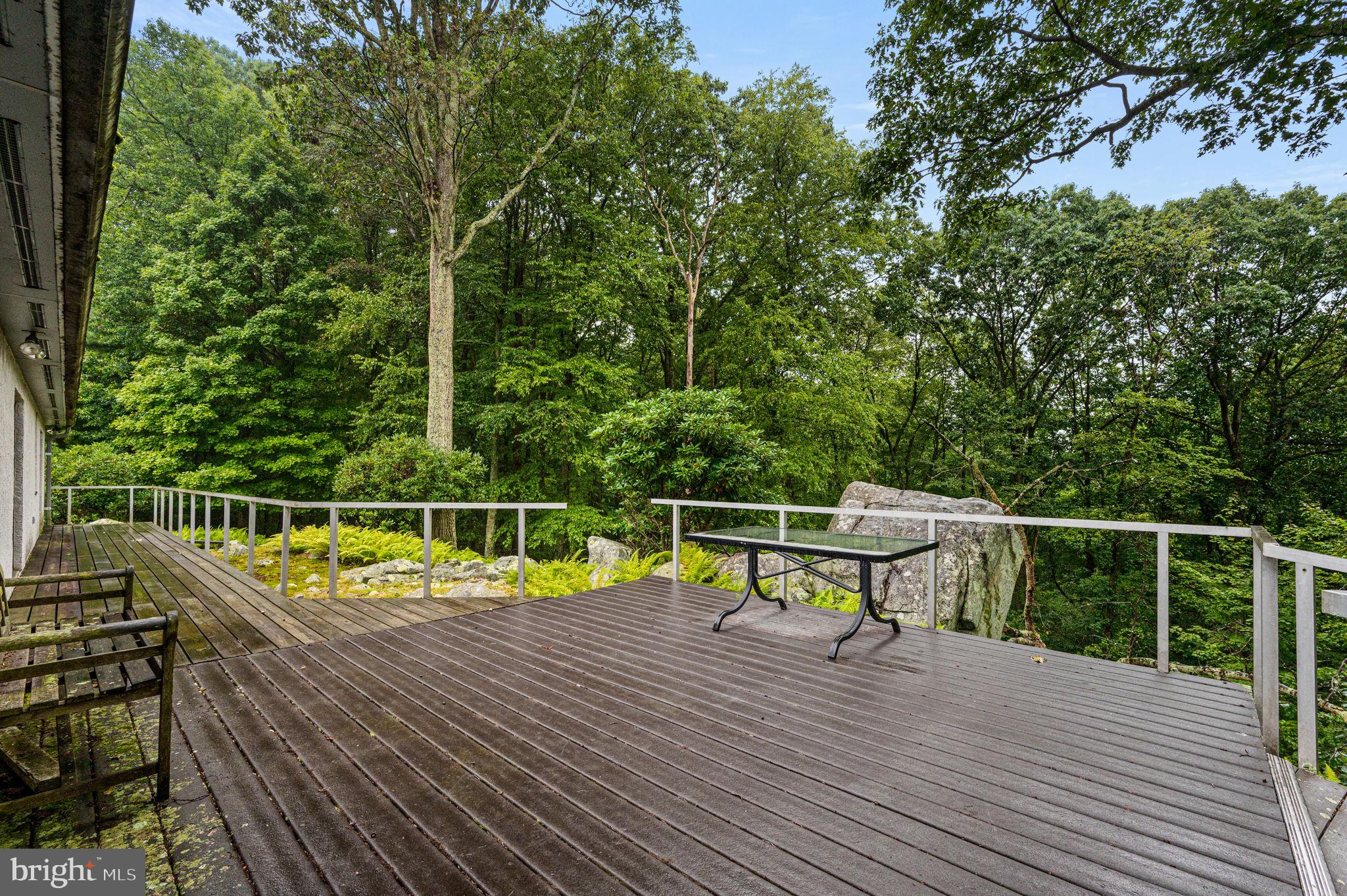38 Lutz Road Boyertown, PA 19512 - Photo 37 of 49 a view of a balcony with wooden floor and seating space