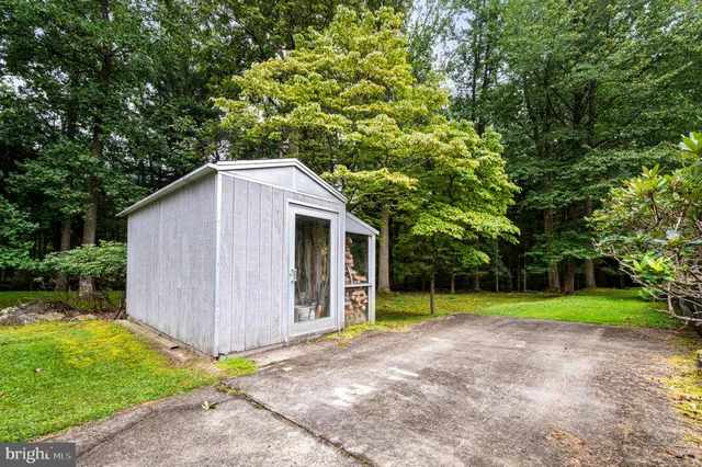 a backyard of a house with trampoline