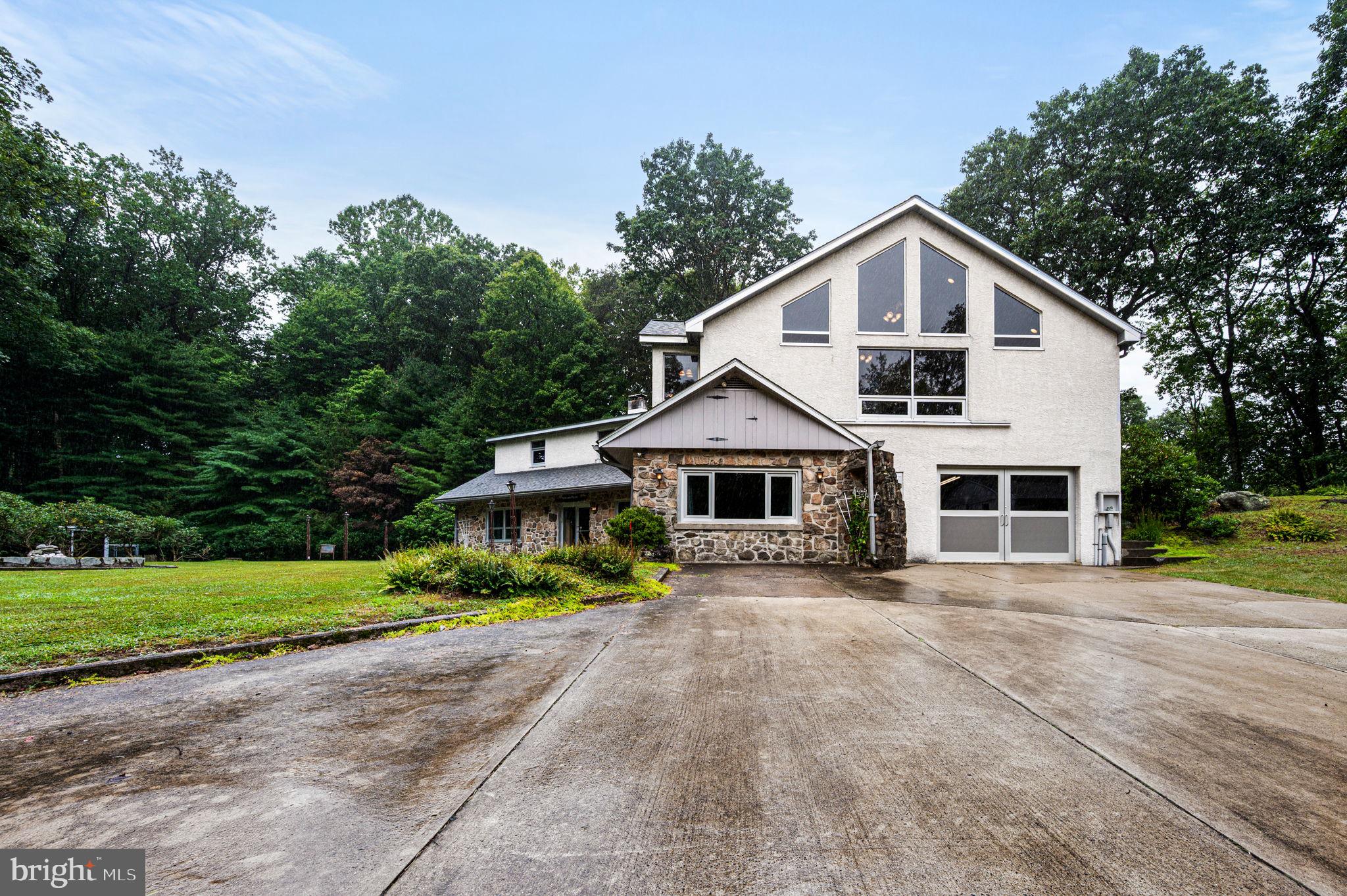 38 Lutz Road Boyertown, PA 19512 - Photo 45 of 49 a front view of a house with a yard and garage