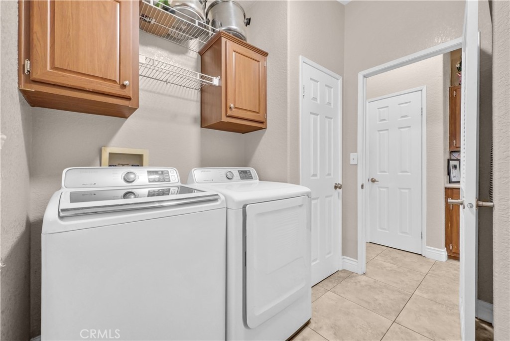 4901 Green River Road, Unit 102 Corona, CA 92878 - Photo 17 of 39 a utility room with dryer and washer