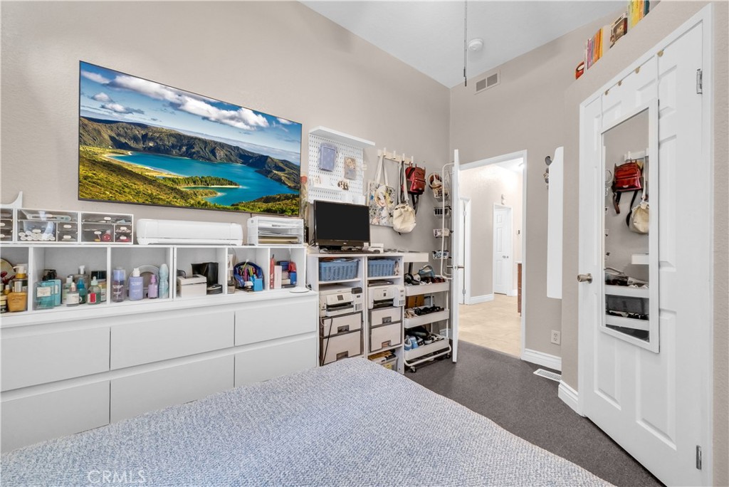 4901 Green River Road, Unit 102 Corona, CA 92878 - Photo 22 of 39 a room with furniture a washer and dryer