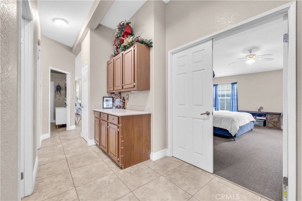 4901 Green River Road, Unit 102 Corona, CA 92878 - Photo 23 of 39 a bedroom with a bed and a sink