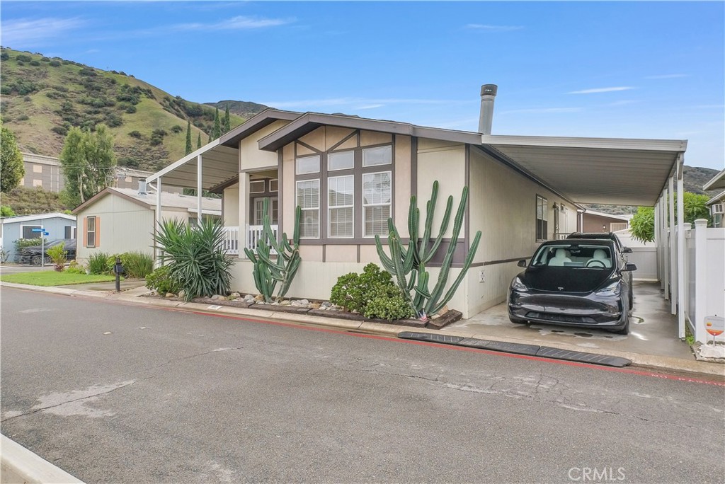 4901 Green River Road, Unit 102 Corona, CA 92878 - Photo 3 of 39 a view of a car garage of a house