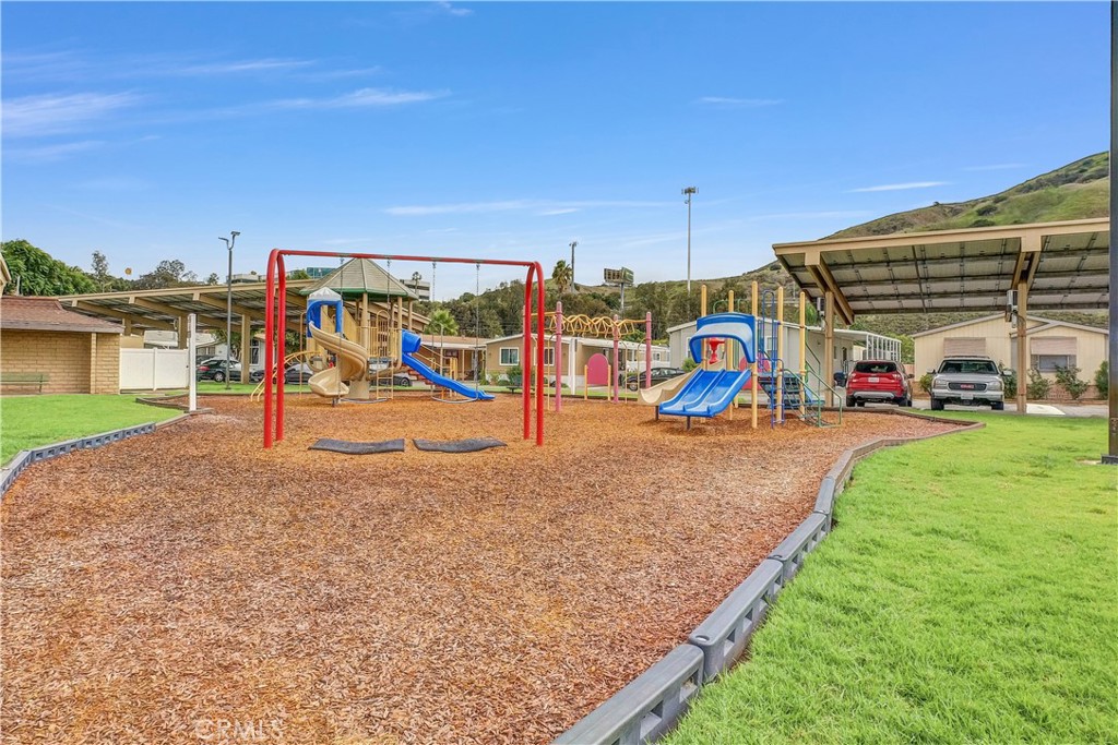 4901 Green River Road, Unit 102 Corona, CA 92878 - Photo 38 of 39 a view of outdoor space with playground and green space