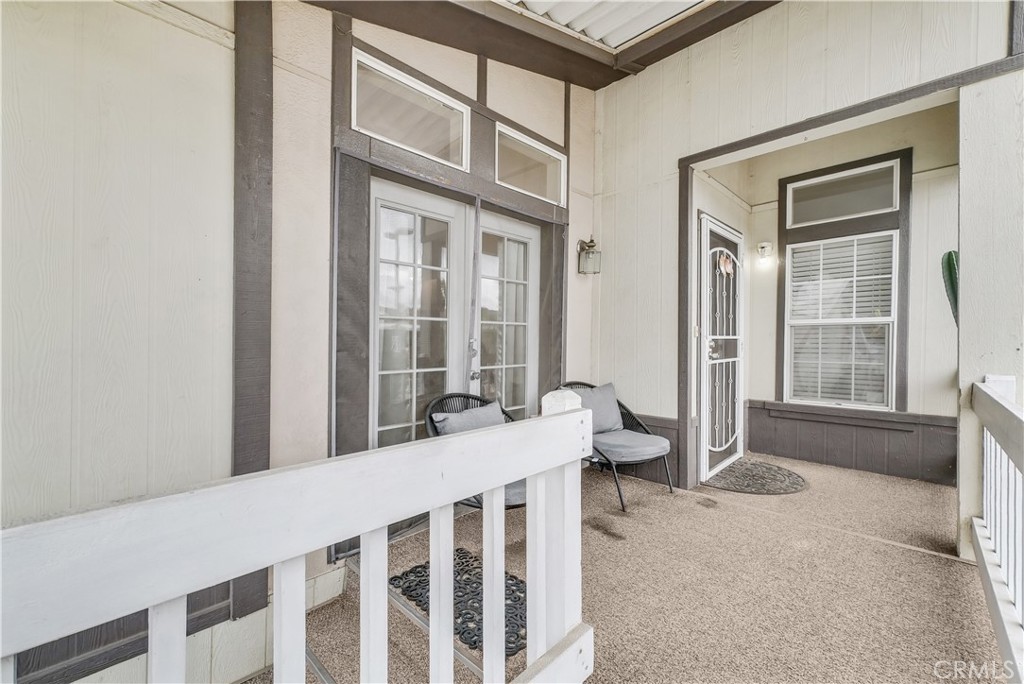 4901 Green River Road, Unit 102 Corona, CA 92878 - Photo 4 of 39 a view of a bedroom with furniture and windows