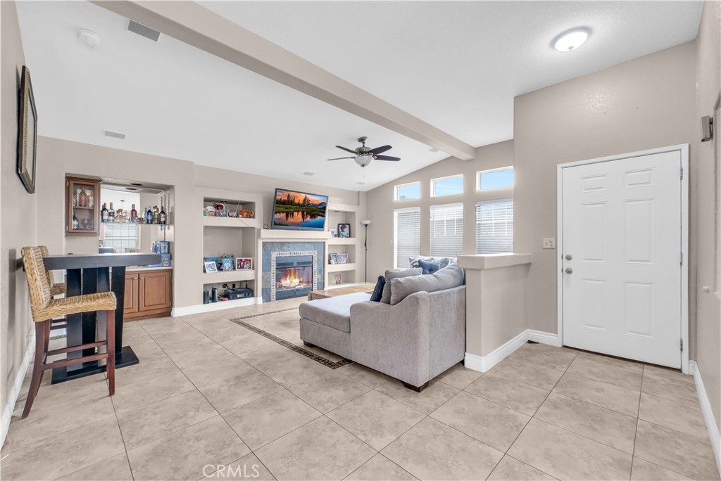 4901 Green River Road, Unit 102 Corona, CA 92878 - Photo 5 of 39 a living room with furniture and a large window
